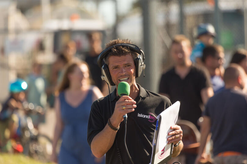 Radio host Carl Ward during a live outside broadcast event for Island FM in Guernsey.