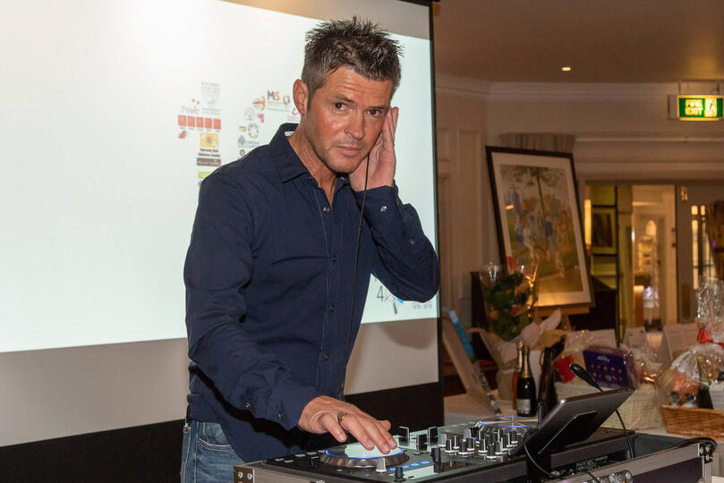 Carl Ward DJing live on the decks in Guernsey, professional photography by Chris George.