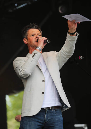 Event host Carl Ward on stage presenting live at the Guernsey Together Festival.