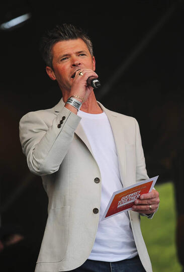 Event host Carl Ward on stage presenting live at the Guernsey Together Festival.